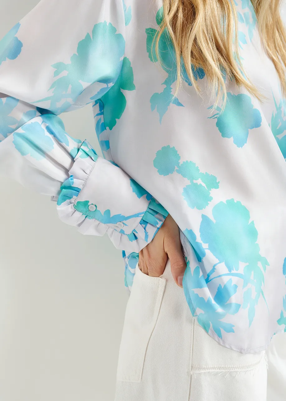 Gebroken witte en blauwe zijden top met bloemenprint