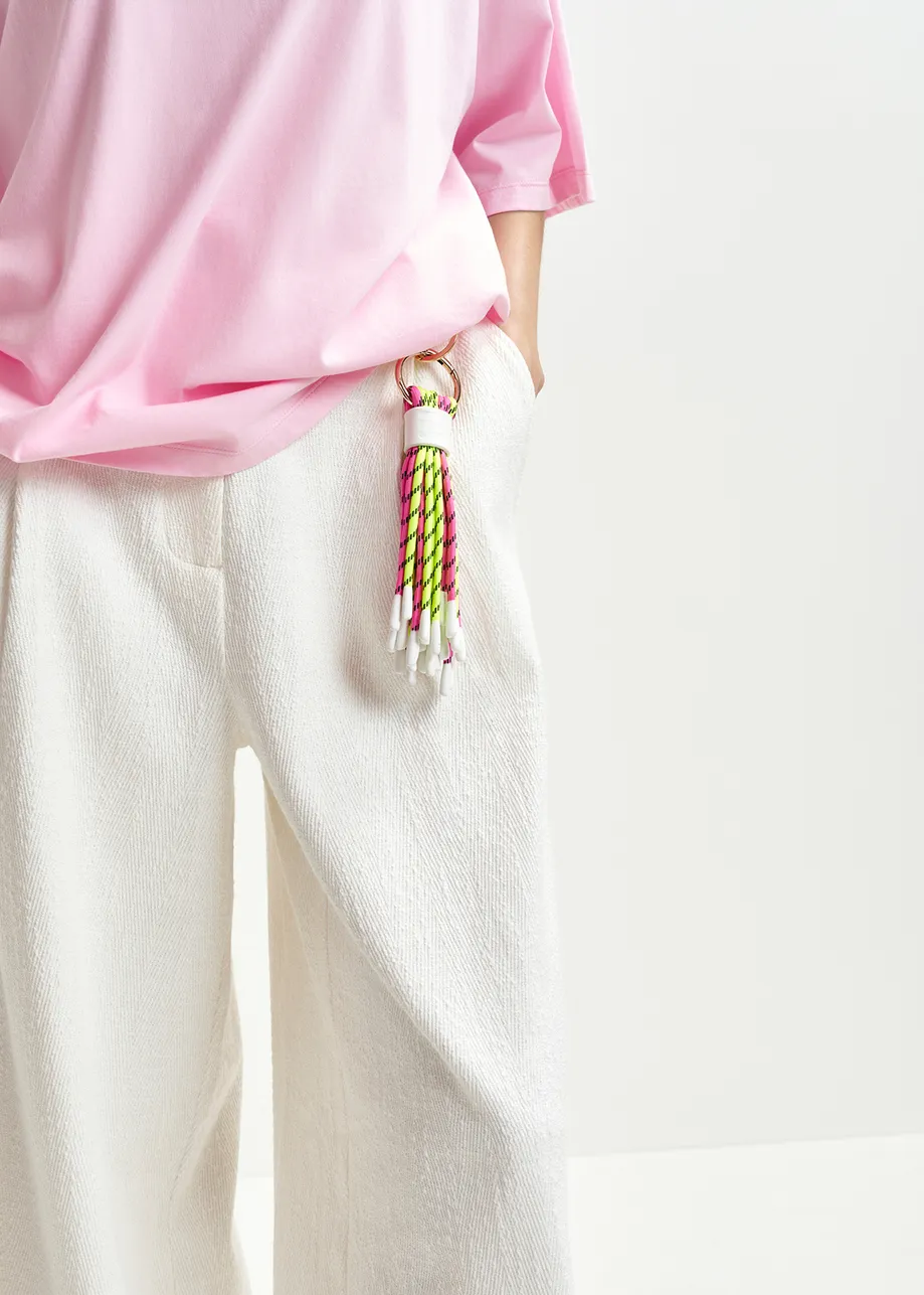 Keychain with pink and yellow braided cords