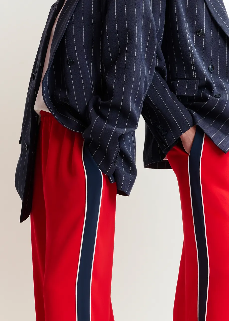 Red and dark blue wide-leg pants with contrast border