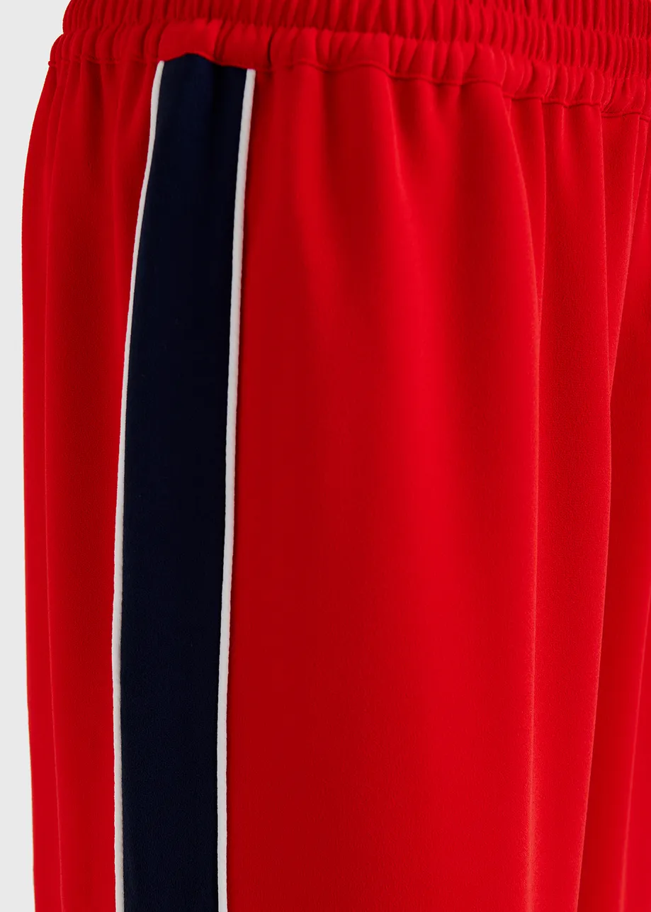 Red and dark blue wide-leg pants with contrast border