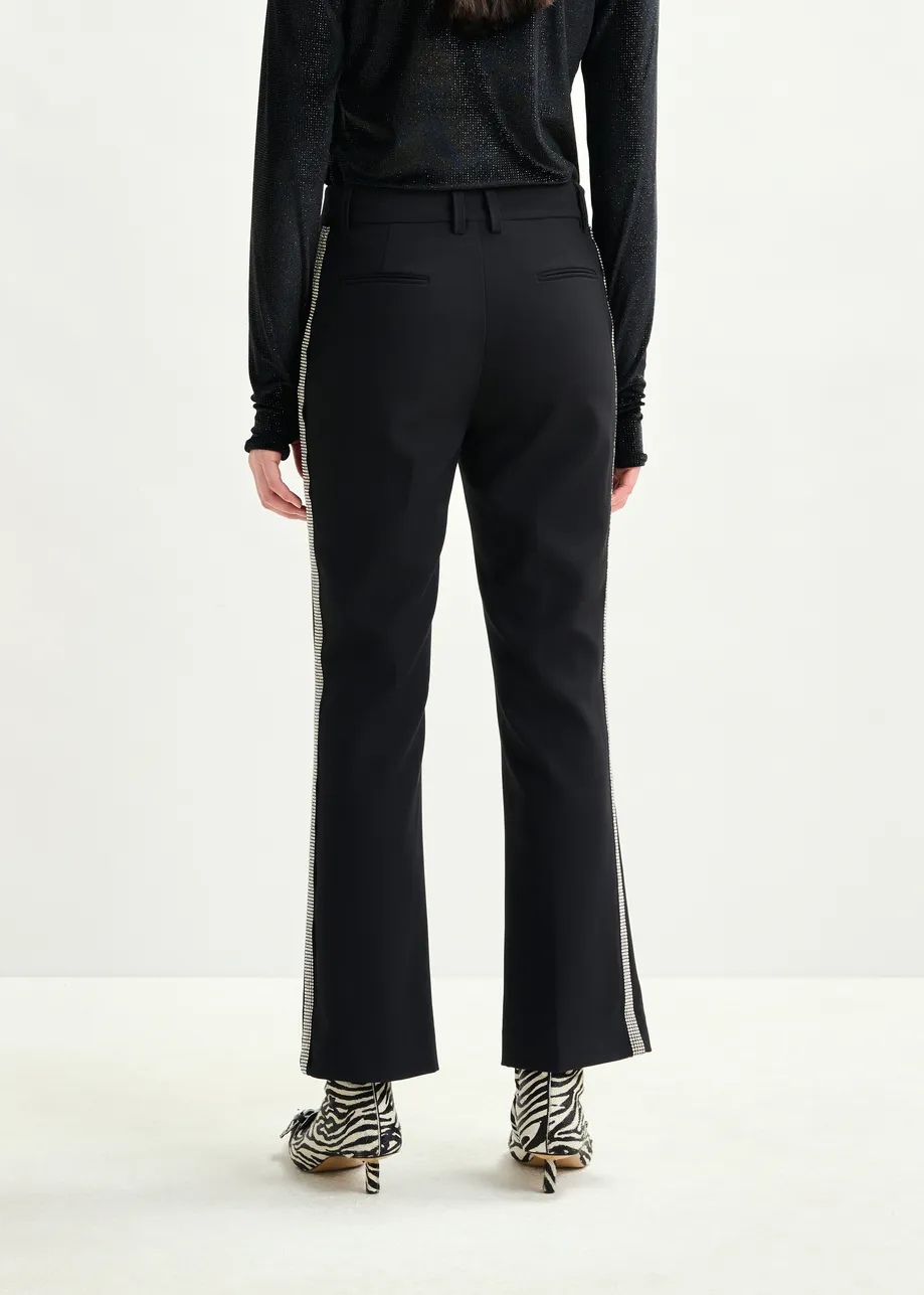 Black flared pants with rhinestone-embellished sideseams
