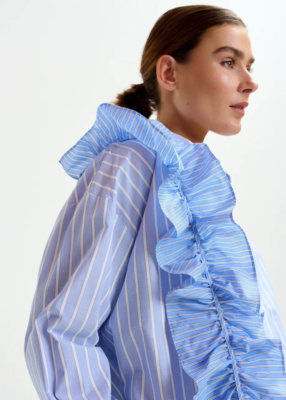 Blue and white striped cotton shirt with ruffle detail