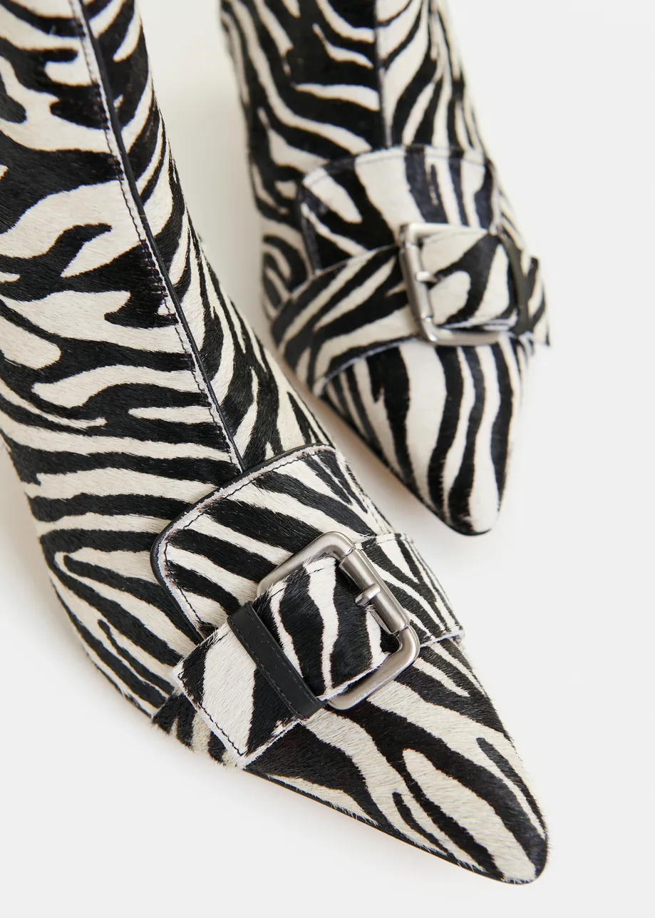 Black and white zebra print leather ankle boots with kitten heel and buckle detail