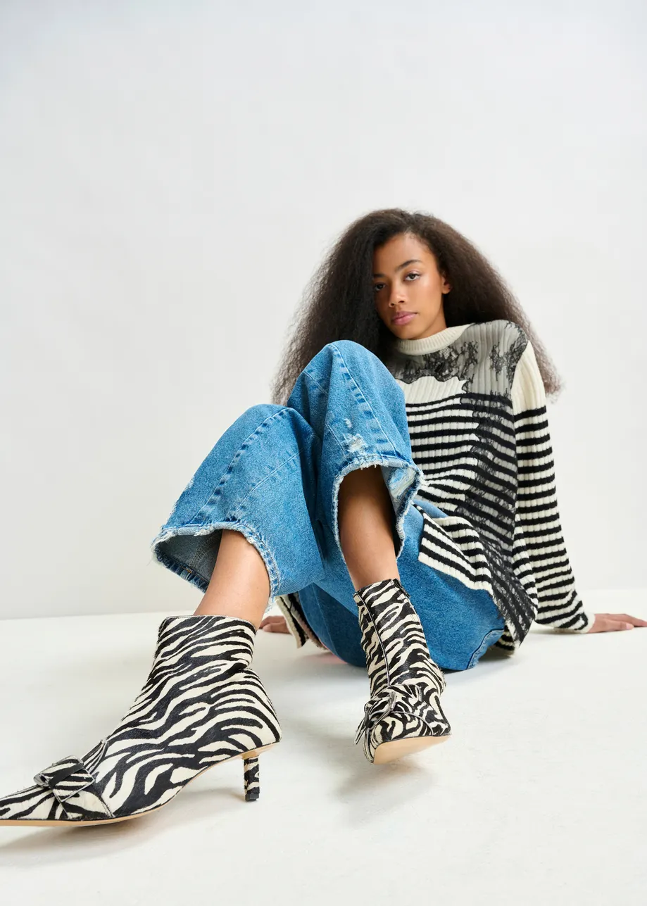 Black and white zebra print leather ankle boots with kitten heel and buckle detail