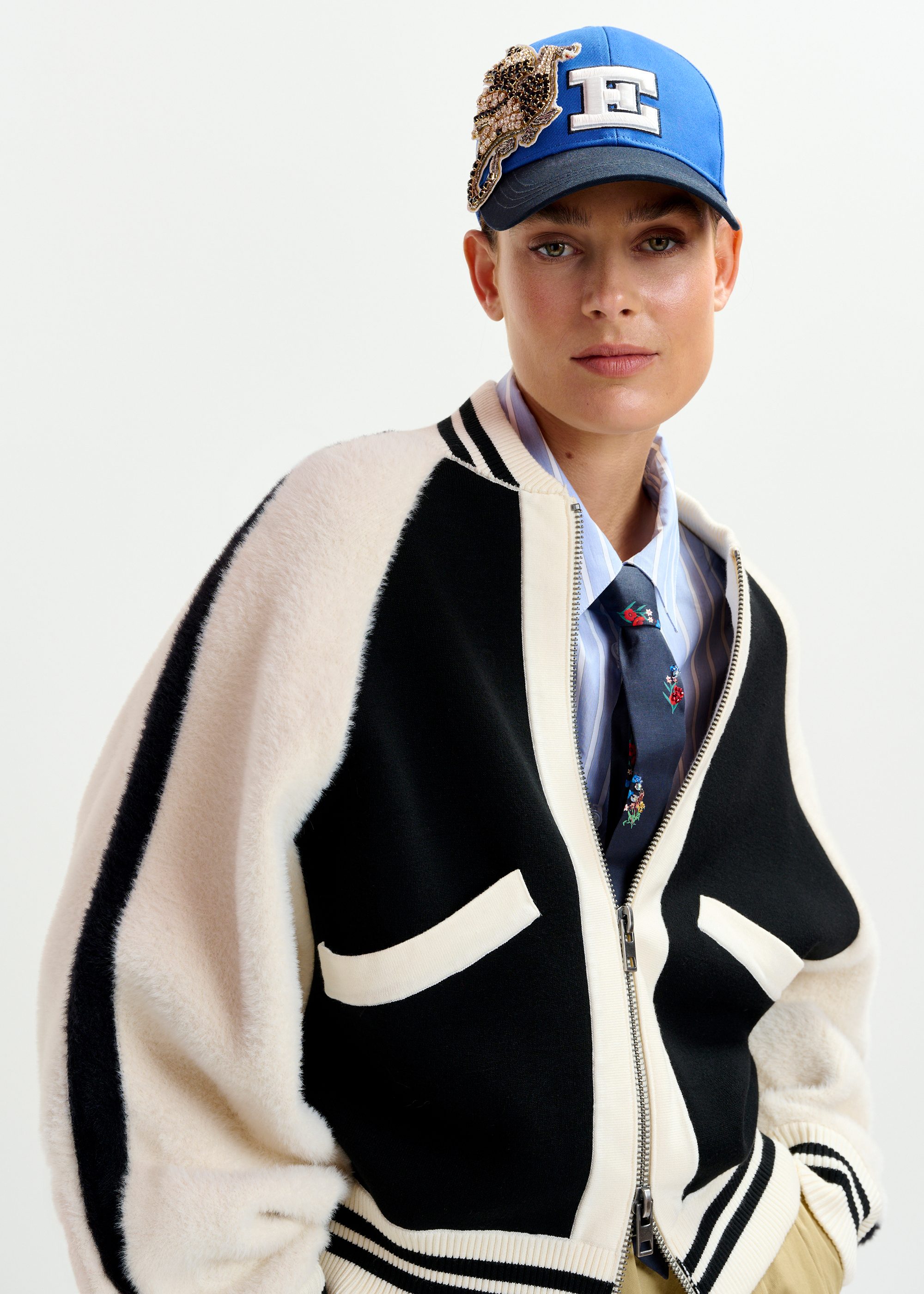 Black and white faux fur-panelled knitted bomber jacket