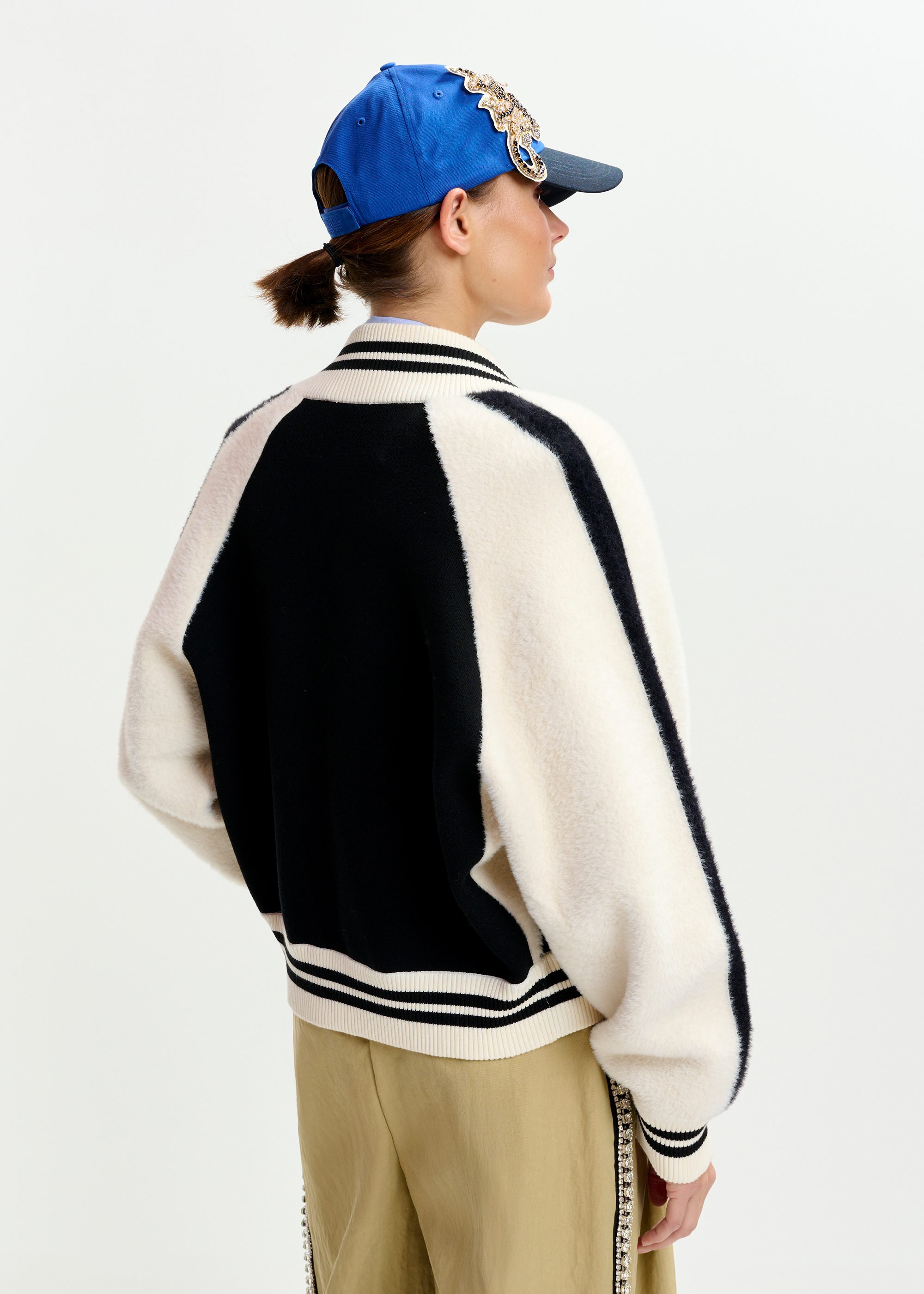 Black and white faux fur-panelled knitted bomber jacket