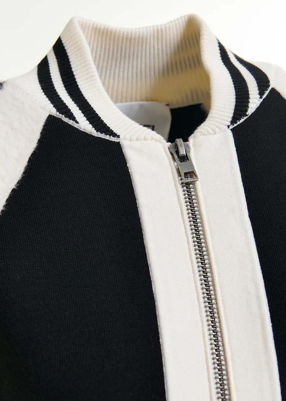 Black and white faux fur-panelled knitted bomber jacket