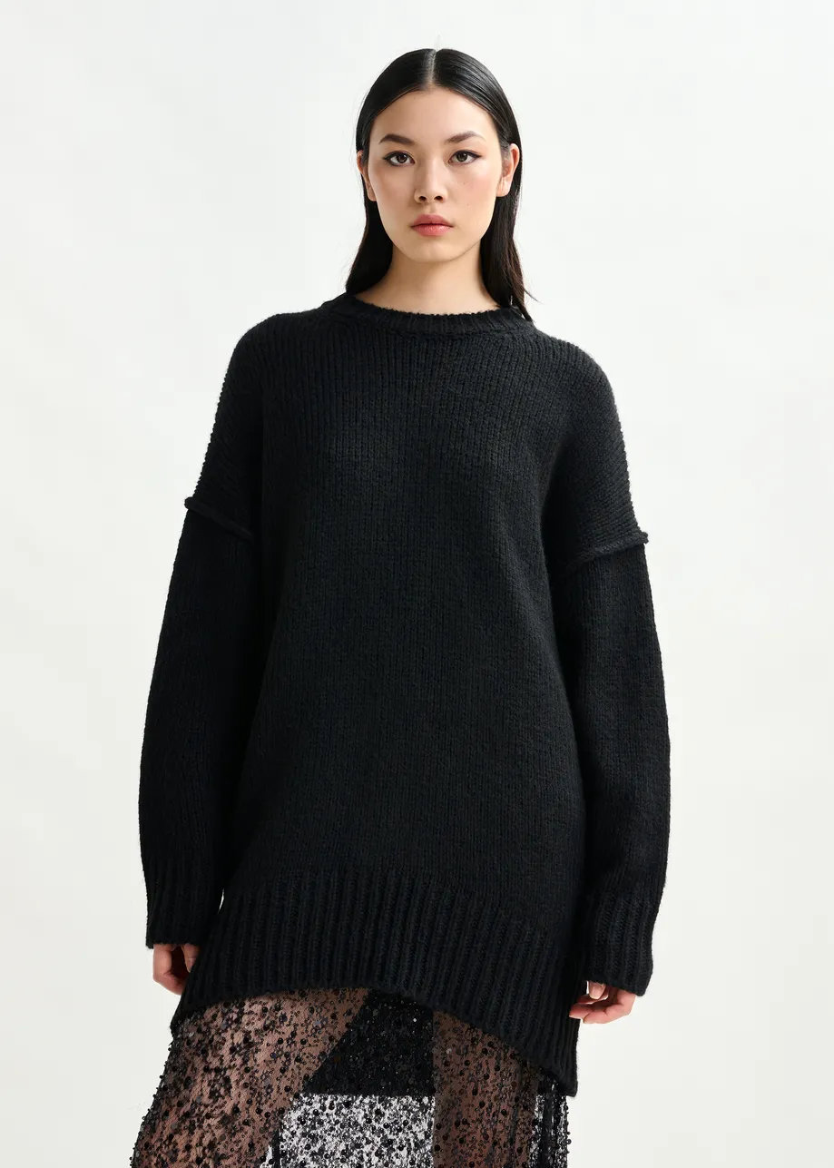 Black knit mini dress with ruffle detail