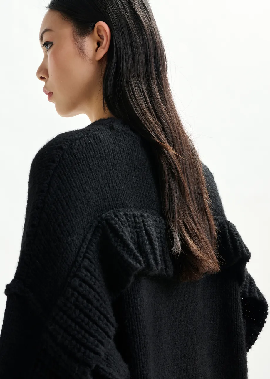 Black knit mini dress with ruffle detail