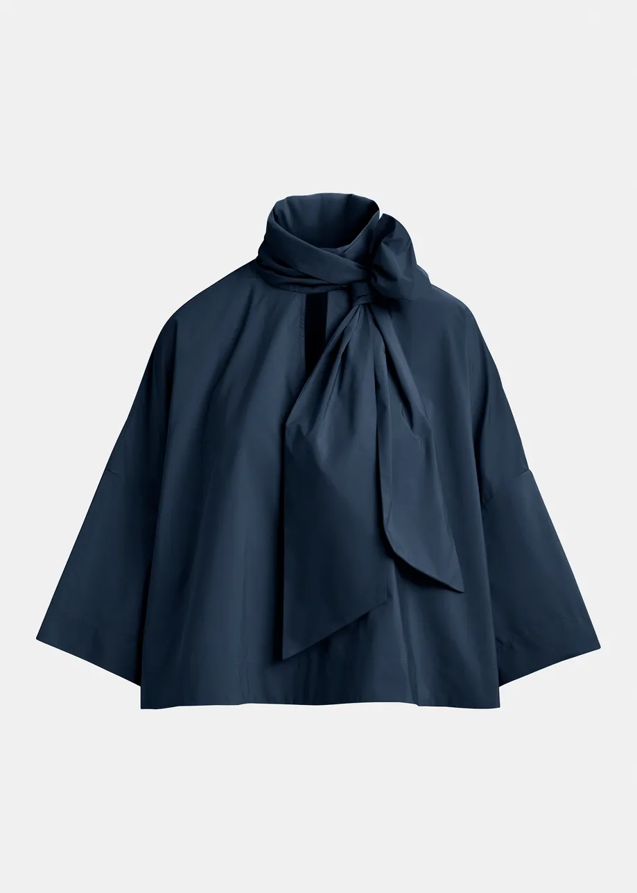 Navy pussy-bow top with trumpet sleeves