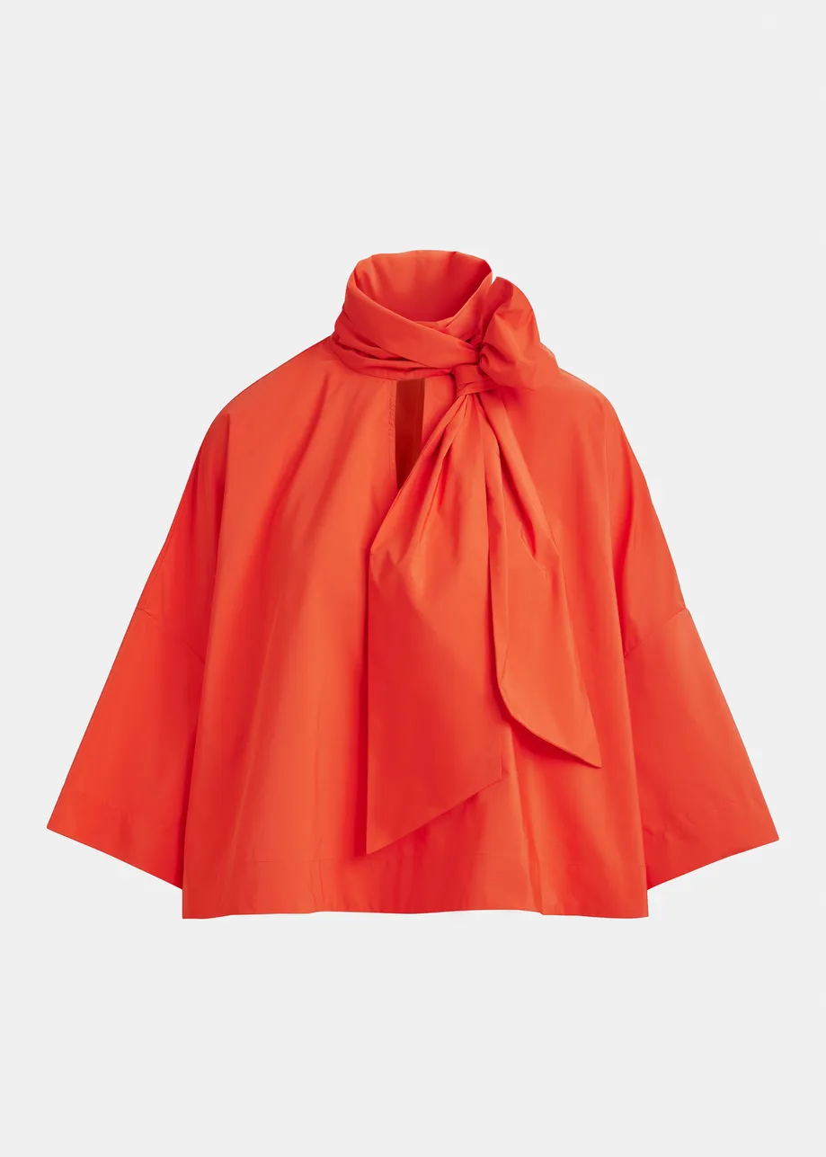Red pussy-bow top with trumpet sleeves