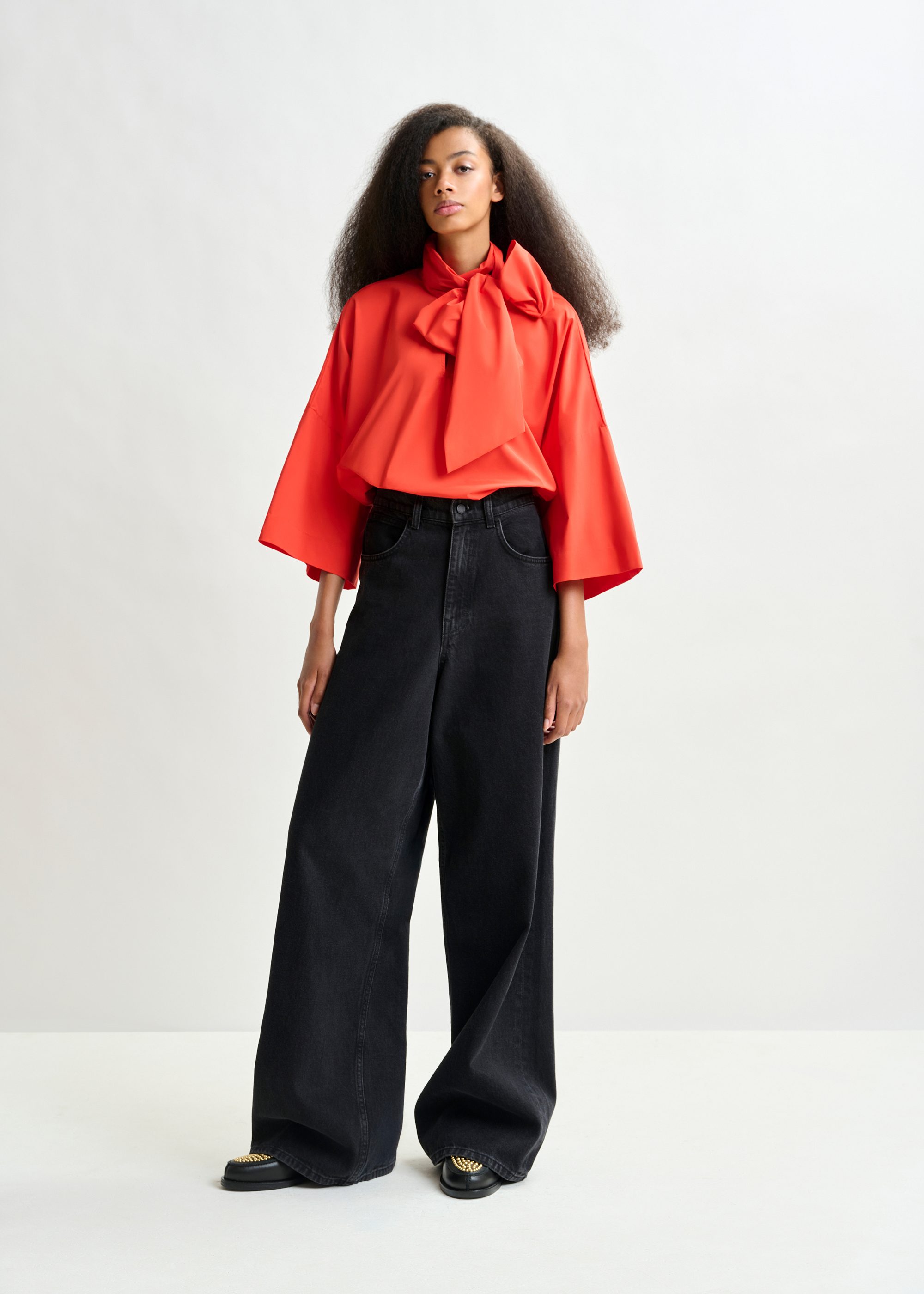Red pussy-bow top with trumpet sleeves | Essentiel Antwerp United