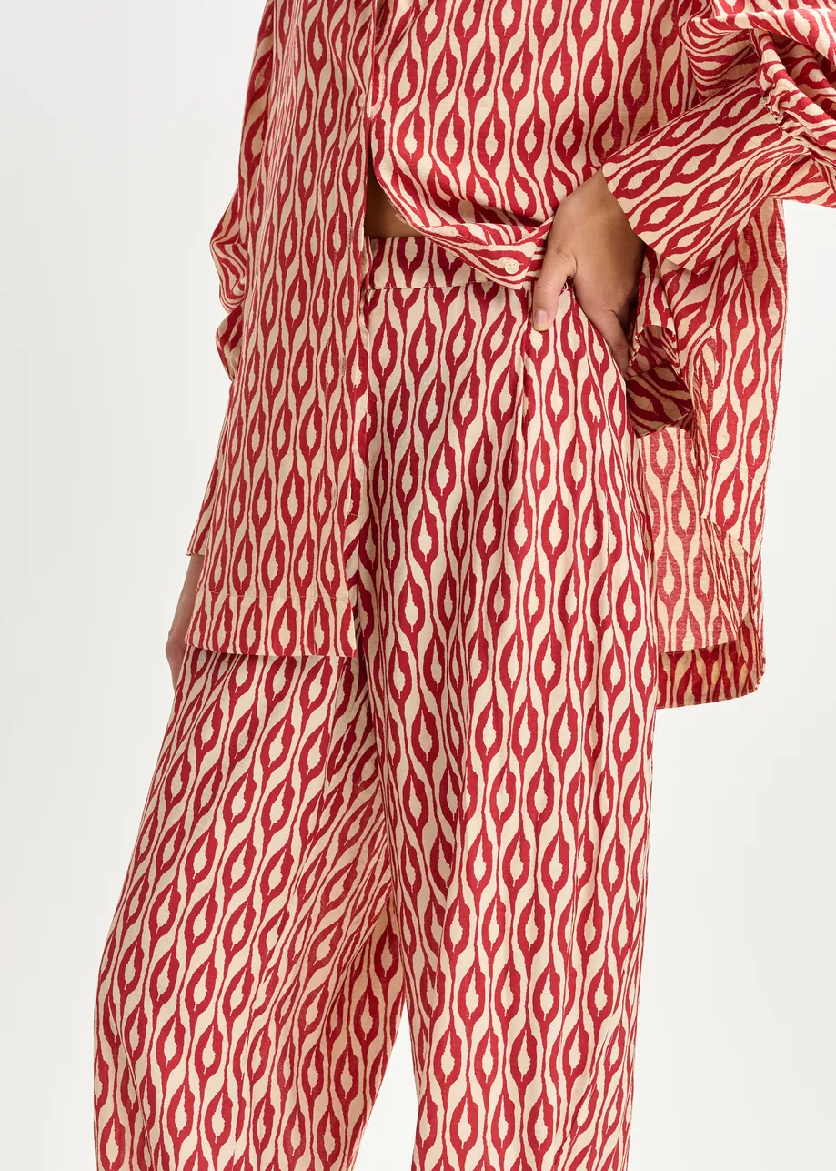 Orange and beige barrel-leg printed pants