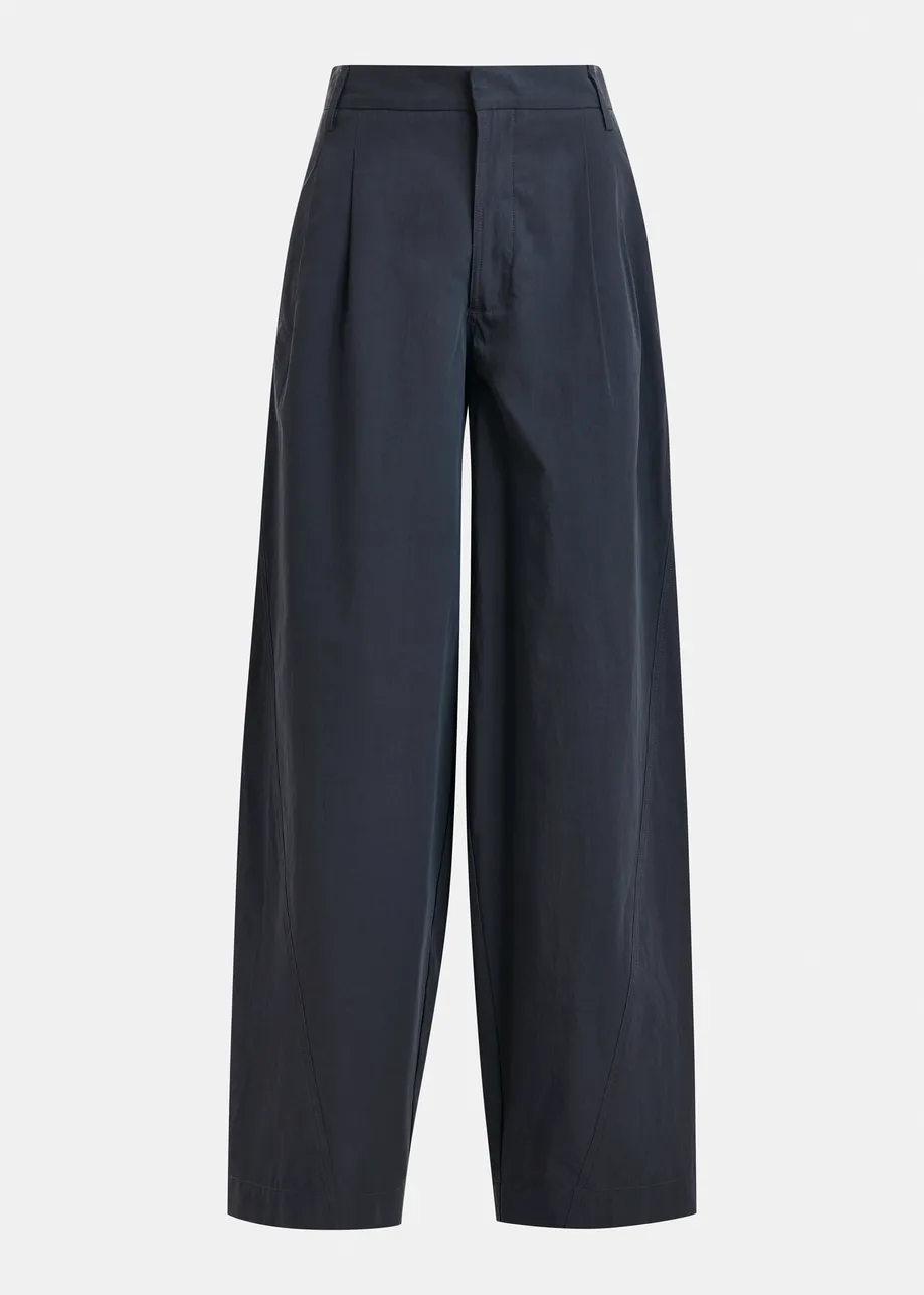 Navy tapered-leg pants with rhinestone belt