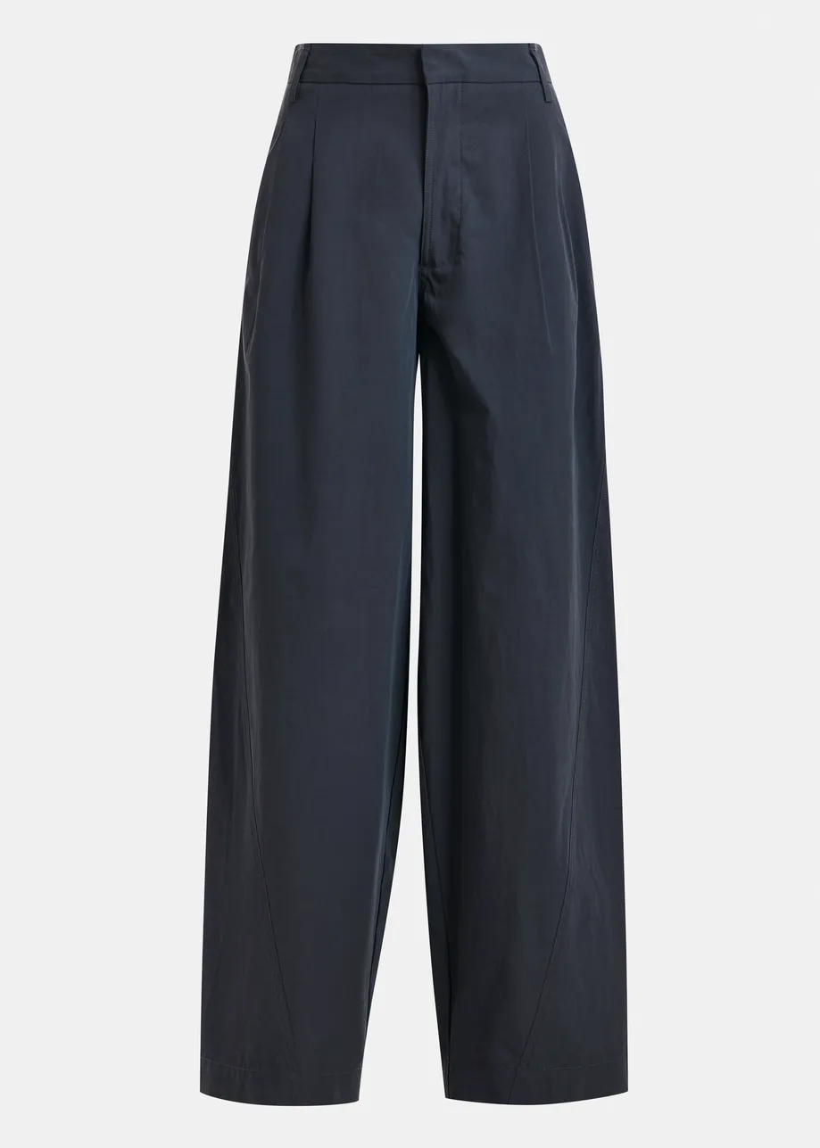 Navy tapered-leg pants with rhinestone belt