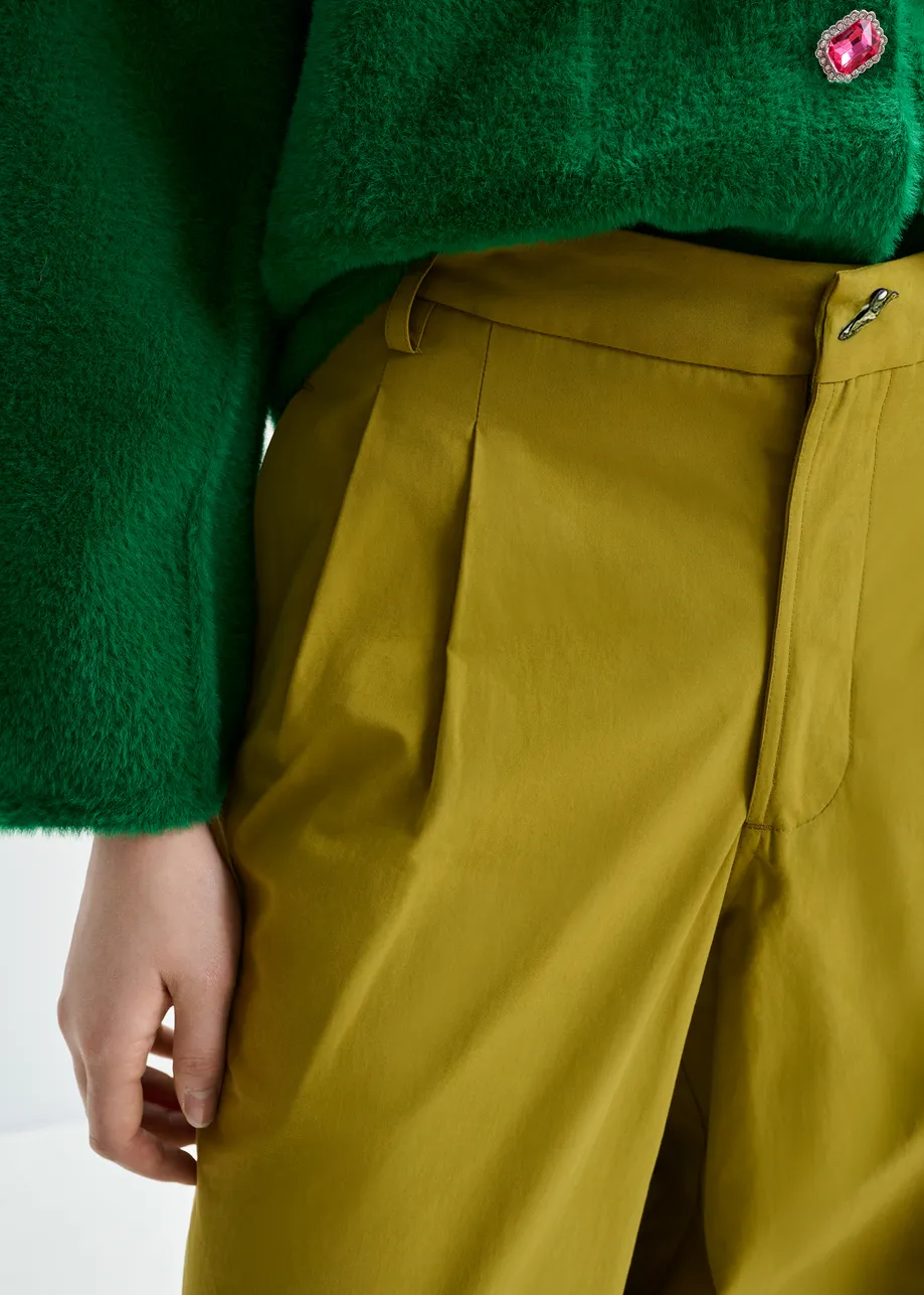 Khaki tapered-leg pants with rhinestone belt