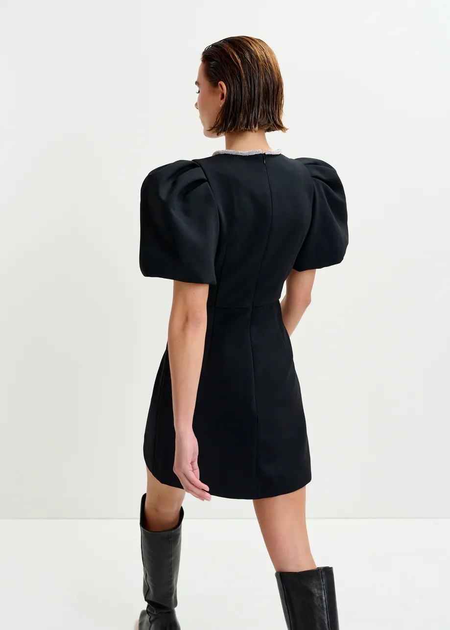 Black mini dress with puff sleeves and rhinestone-embellished keyhole neckline