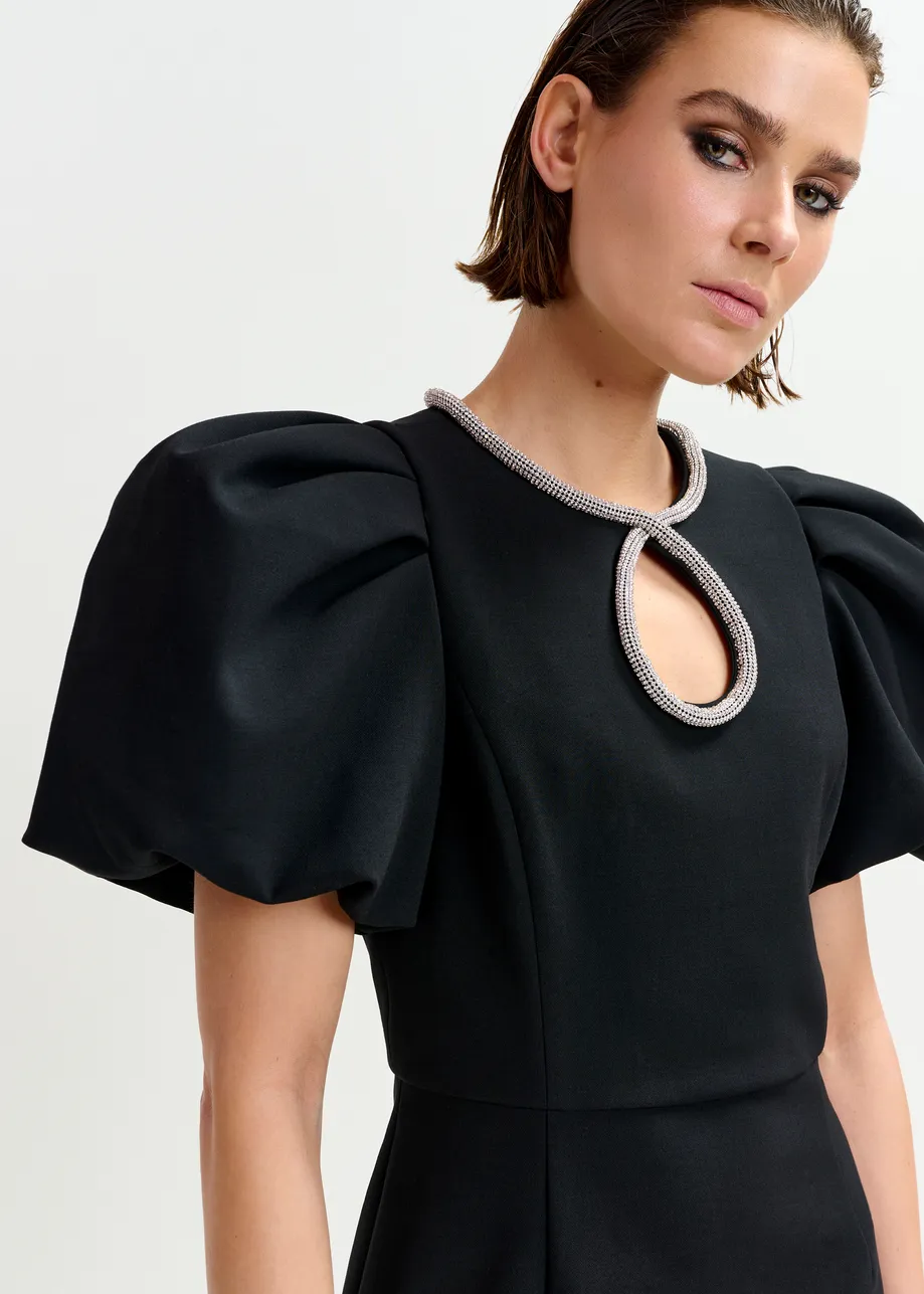 Black mini dress with puff sleeves and rhinestone-embellished keyhole neckline