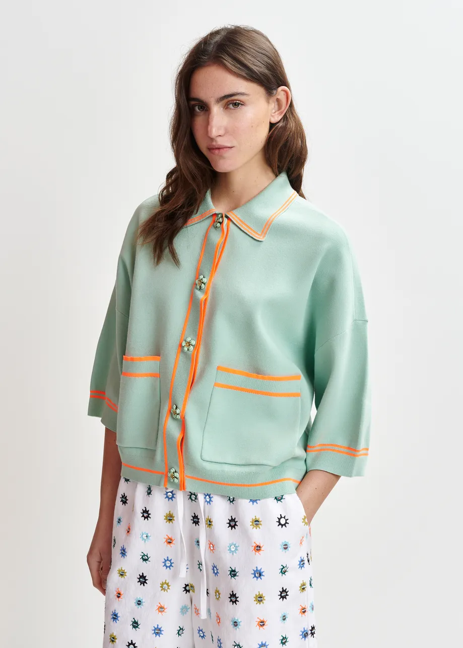 Light blue and orange knit cardigan with flower buttons and contrasting trims