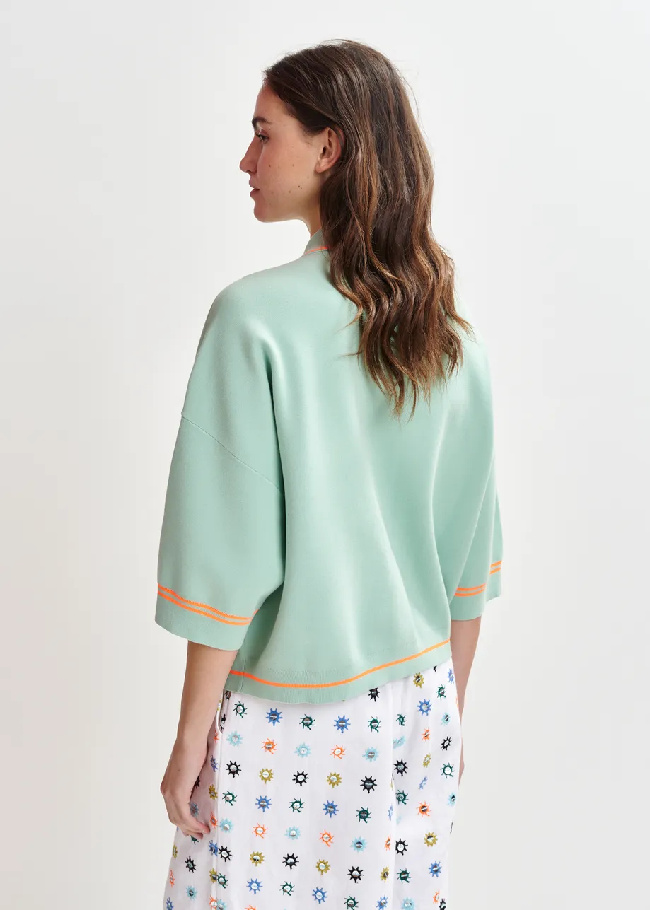 Light blue and orange knit cardigan with flower buttons and contrasting trims