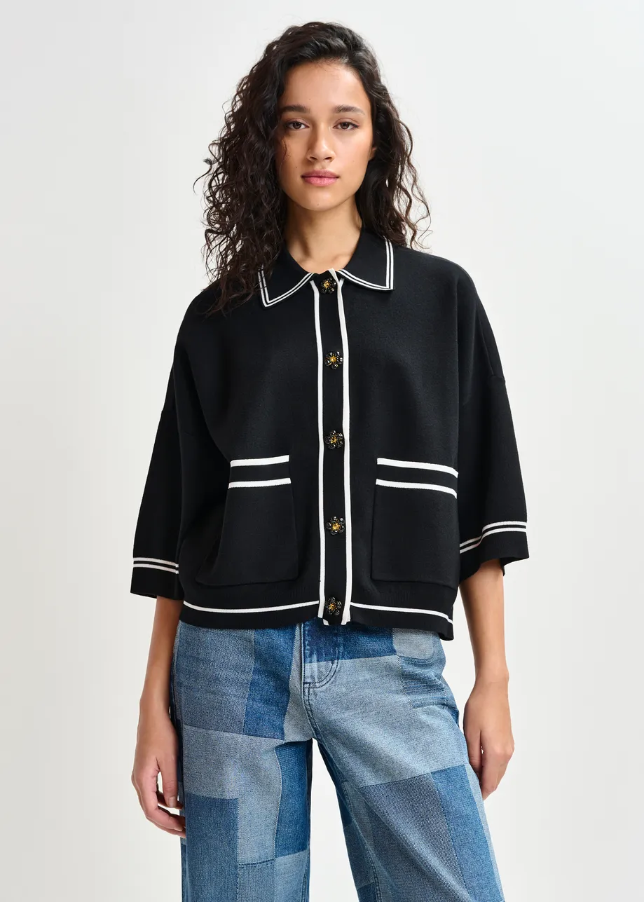 Black and white knit cardigan with flower buttons and contrasting trims