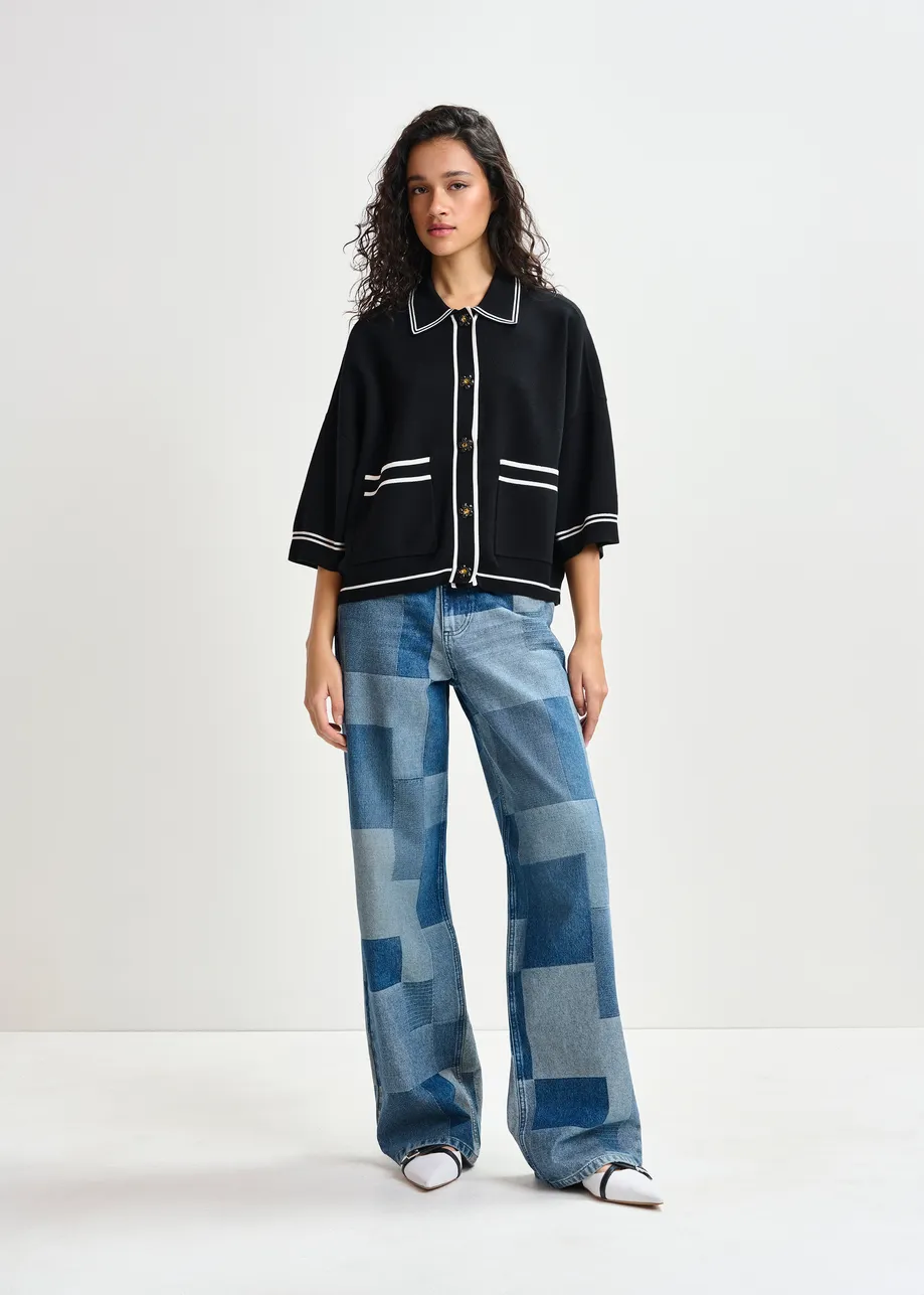 Black and white knit cardigan with flower buttons and contrasting trims