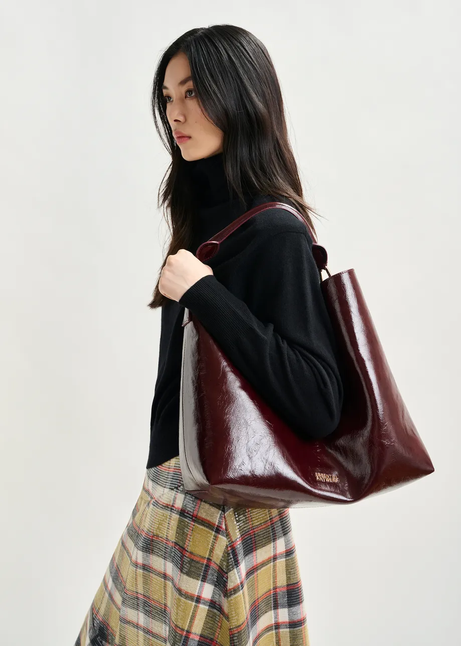 Black wool-blend turtleneck sweater with removable shoulder pads