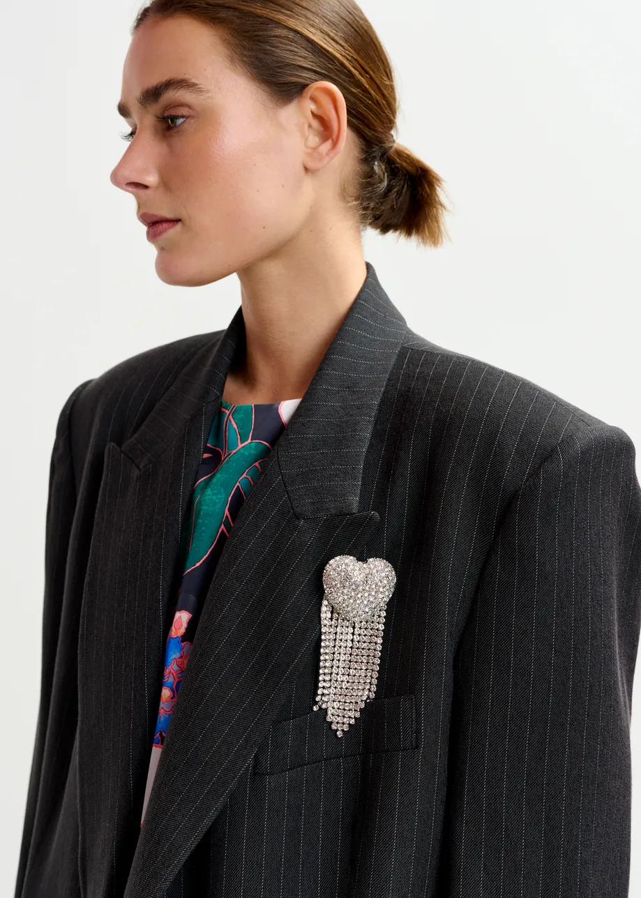 Silver heart-shaped rhinestone brooch with dangling strands