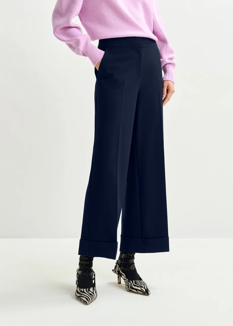 Navy cropped pants with folded cuffs