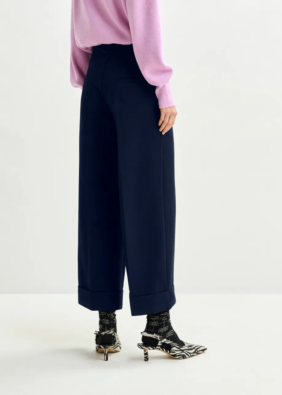 Navy cropped pants with folded cuffs