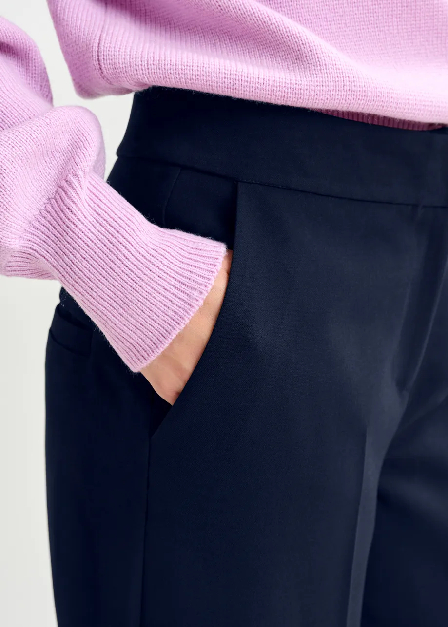 Navy cropped pants with folded cuffs