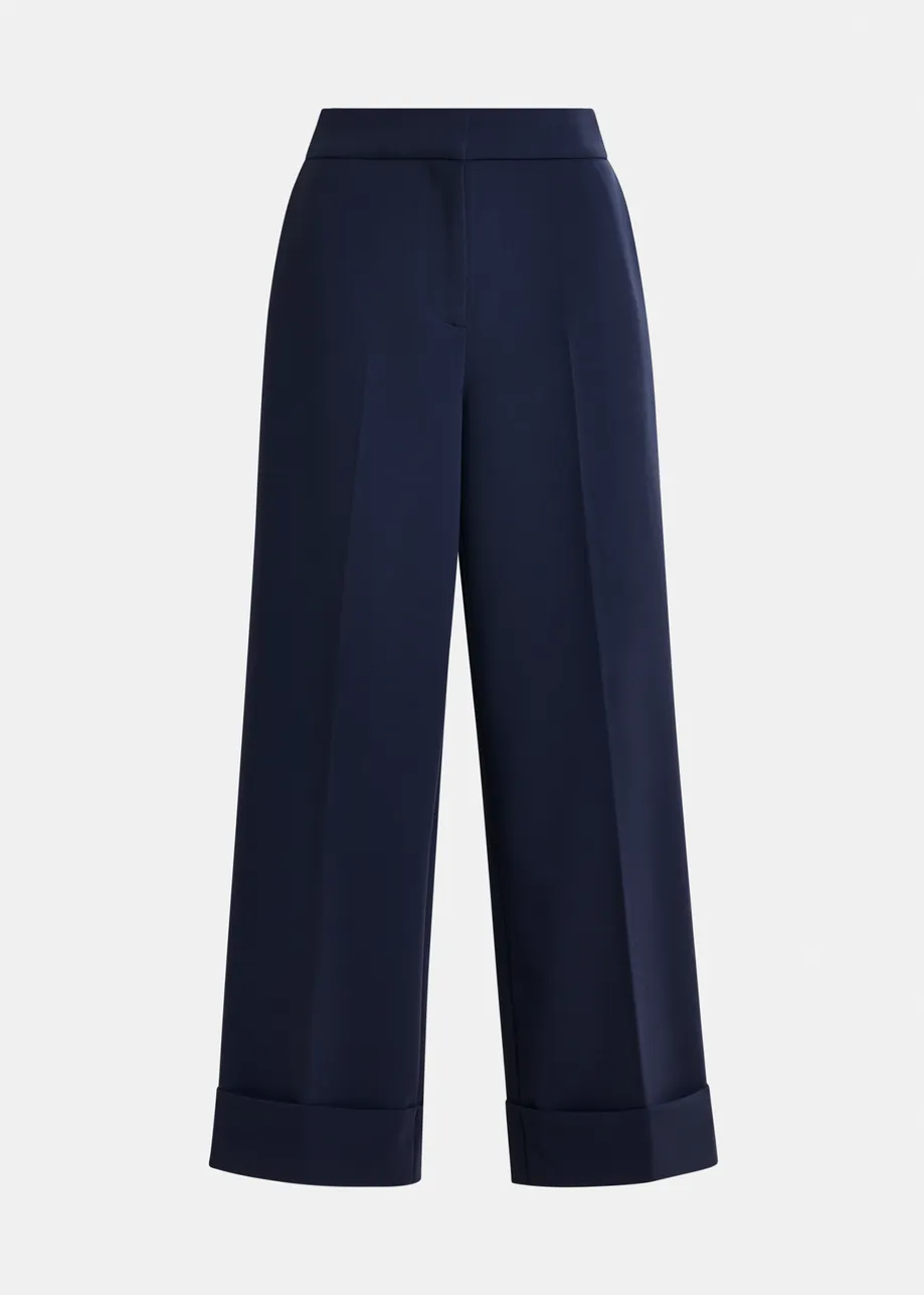 Navy cropped pants with folded cuffs
