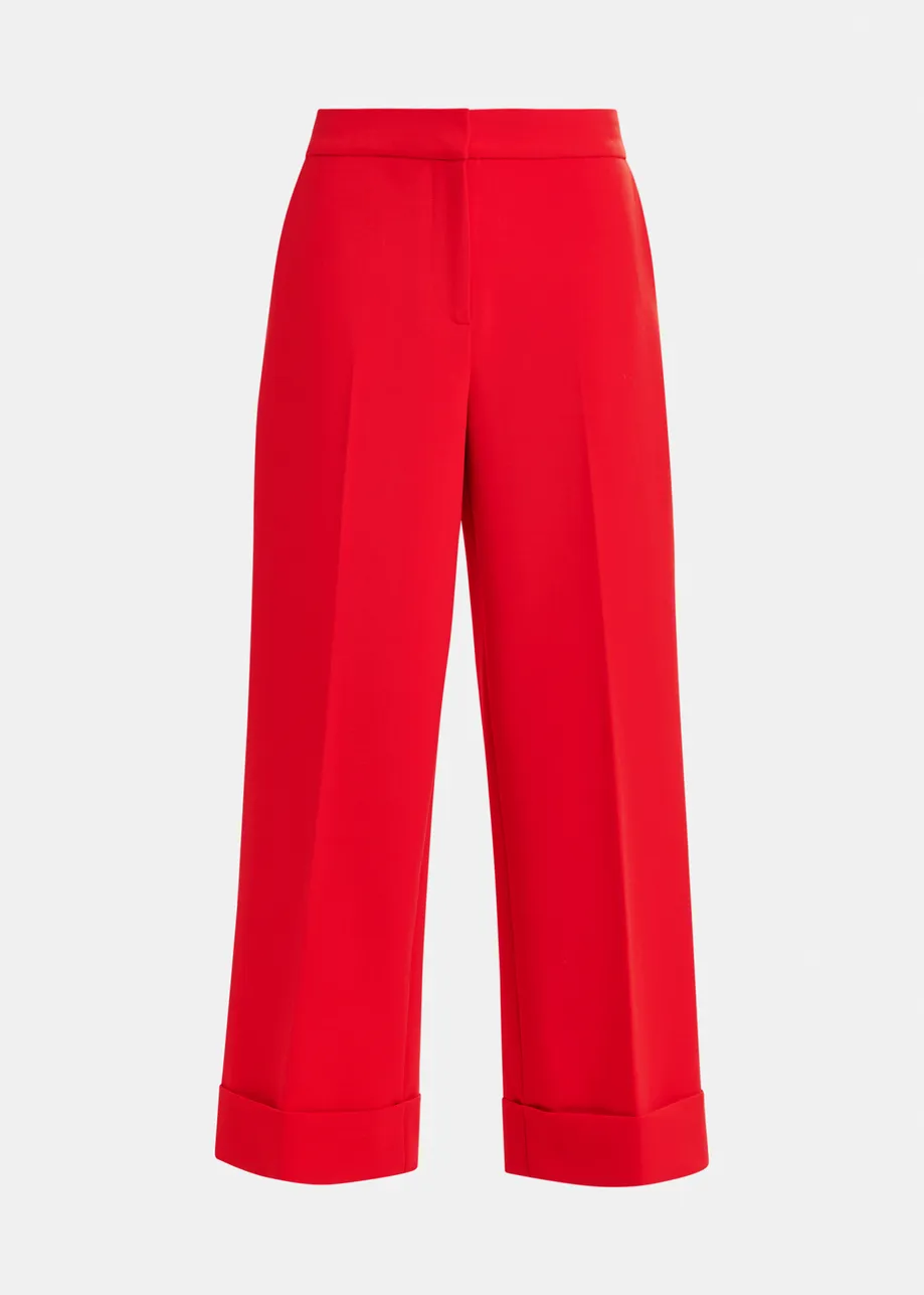 Red cropped pants with folded cuffs