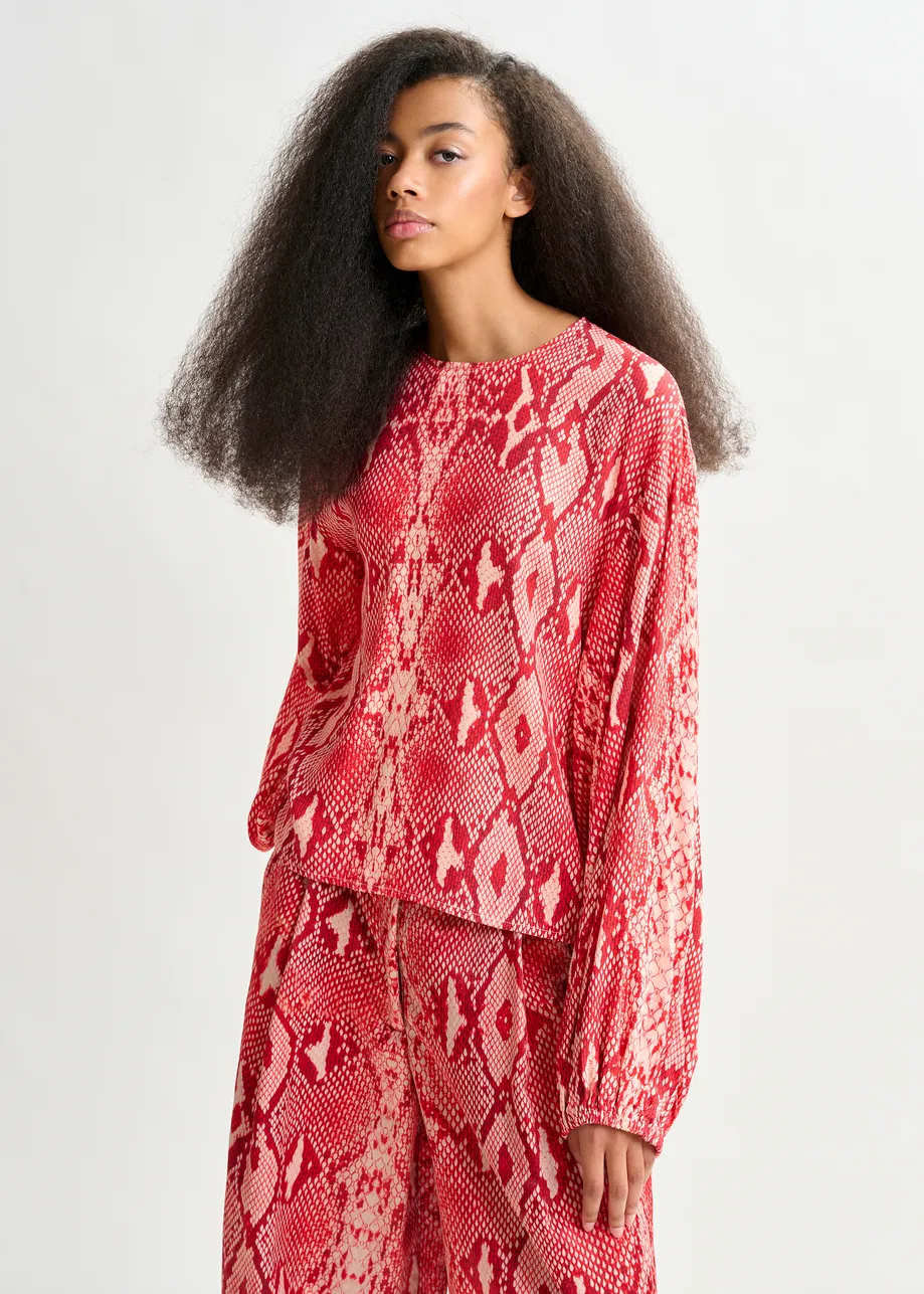 Red and orange top with puffed sleeves