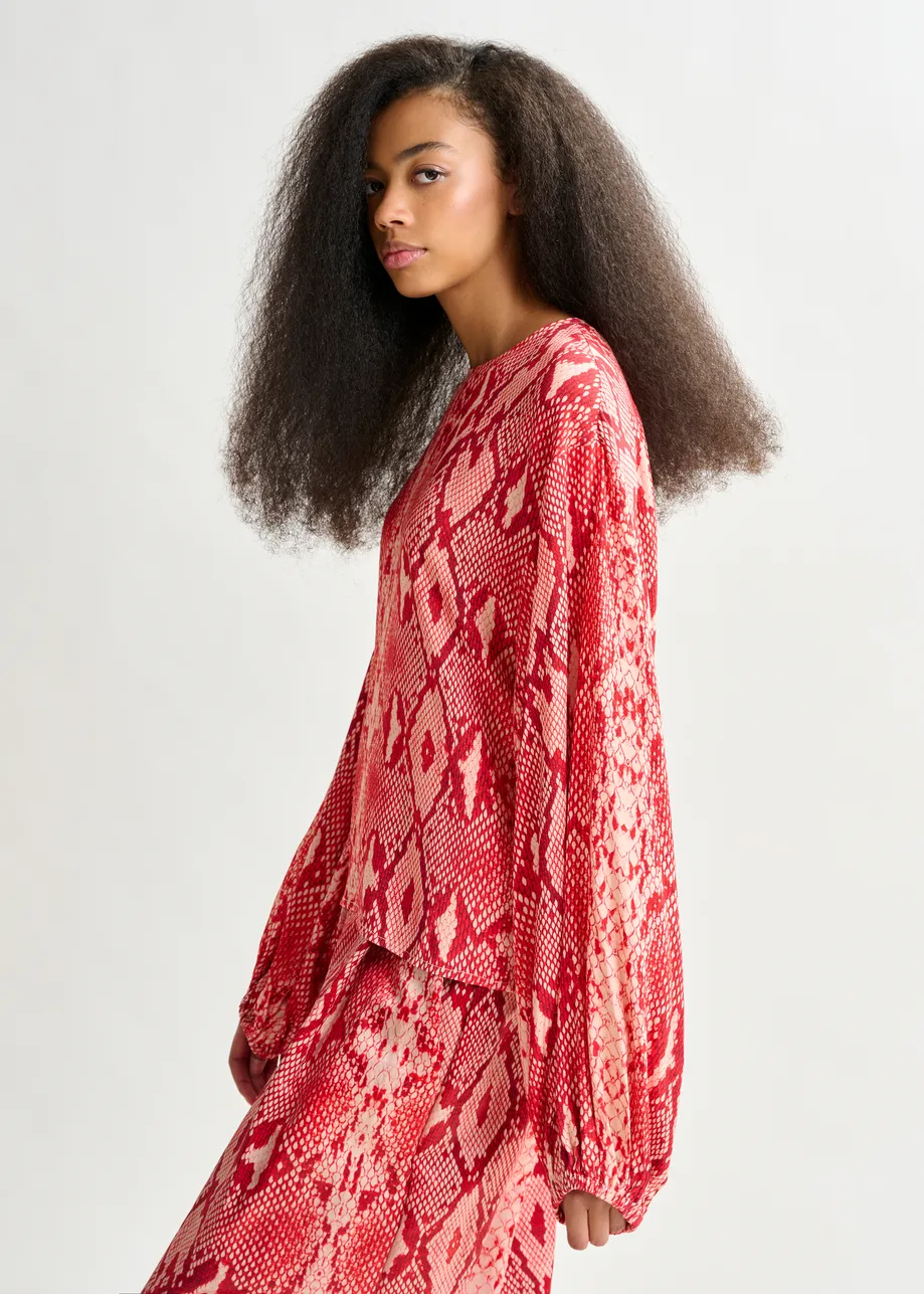 Red and orange top with puffed sleeves