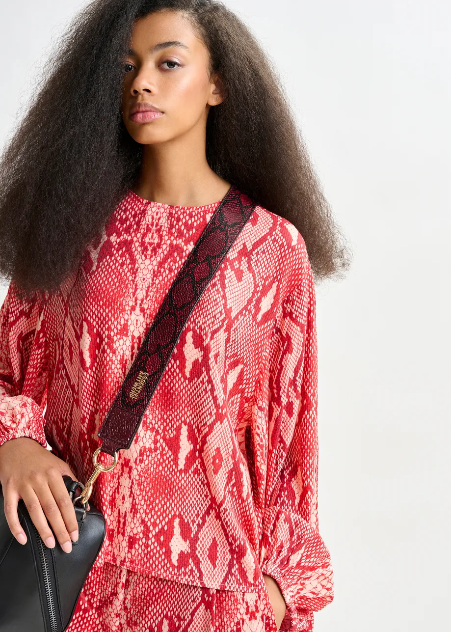 Red and orange top with puffed sleeves
