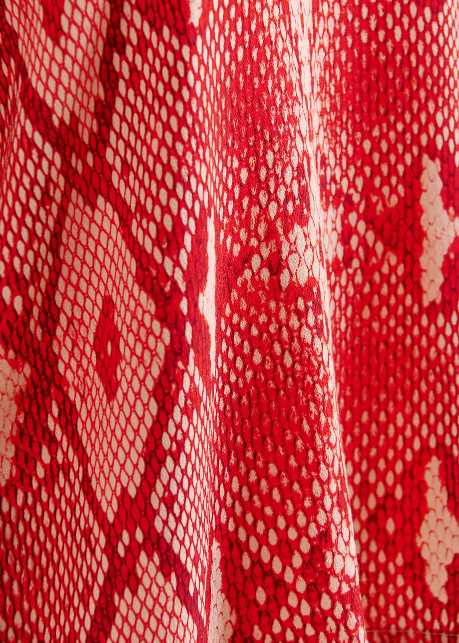Red and orange top with puffed sleeves