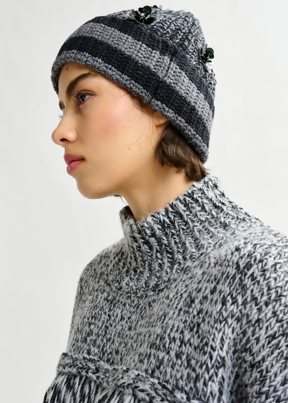 Grey and black wool-blend sweater with fringe details