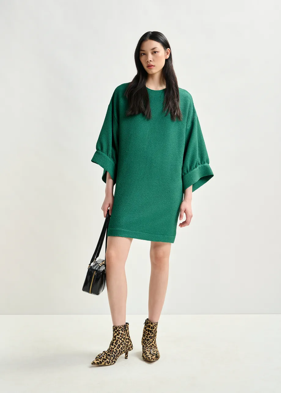 Green mini dress with wide sleeves