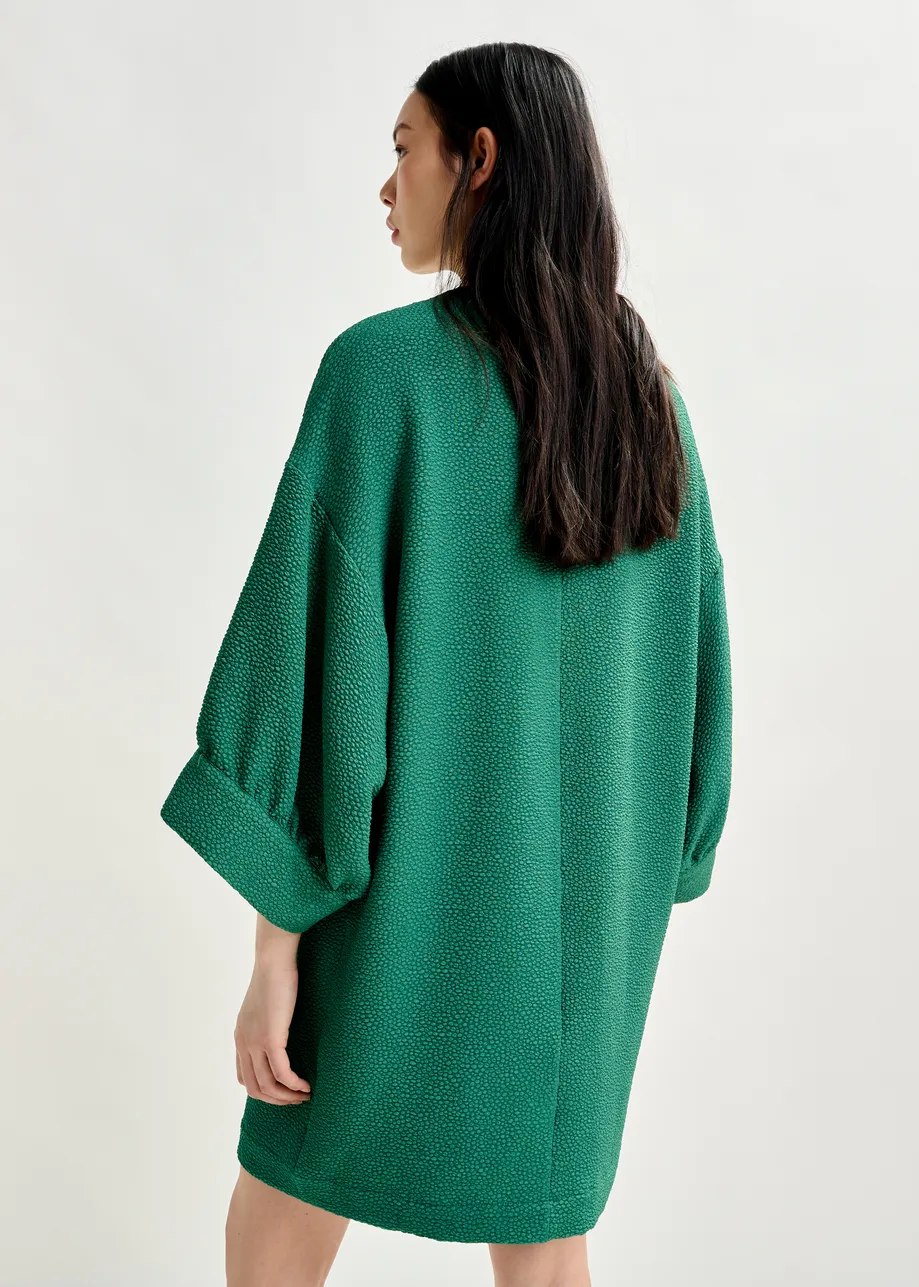 Green mini dress with wide sleeves