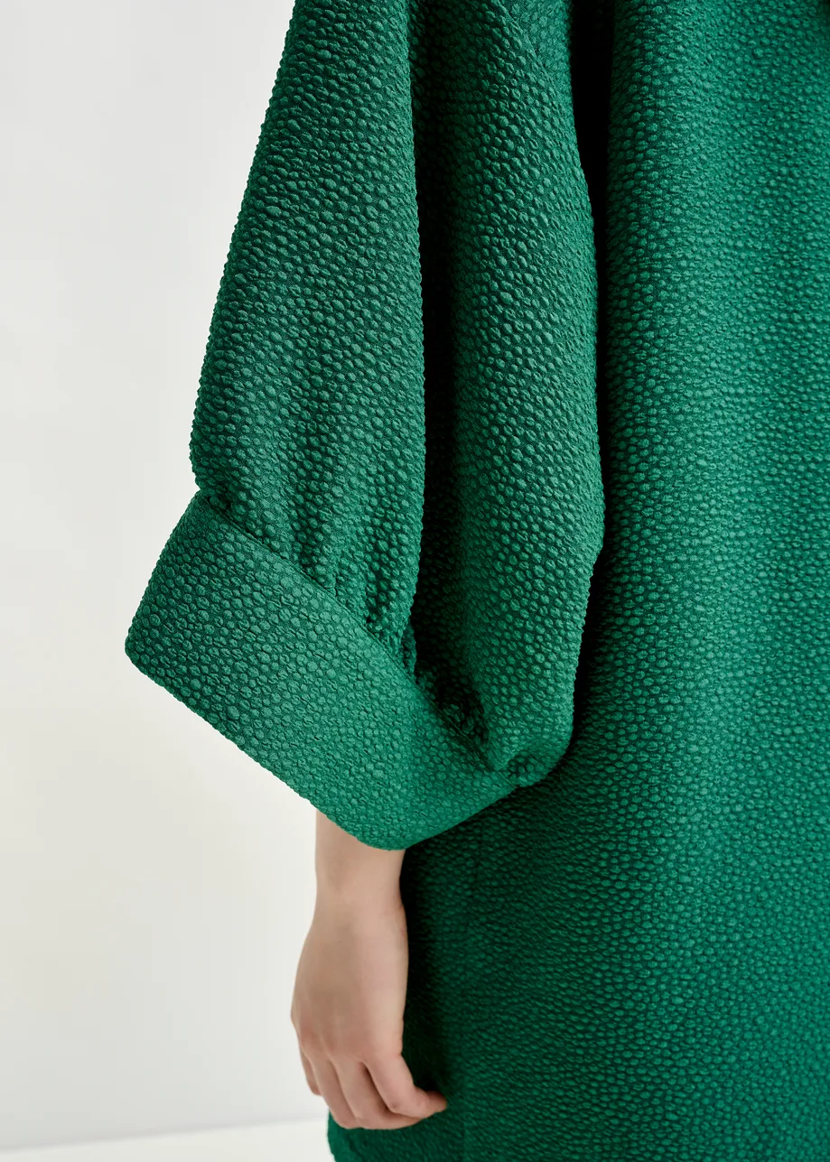 Green mini dress with wide sleeves