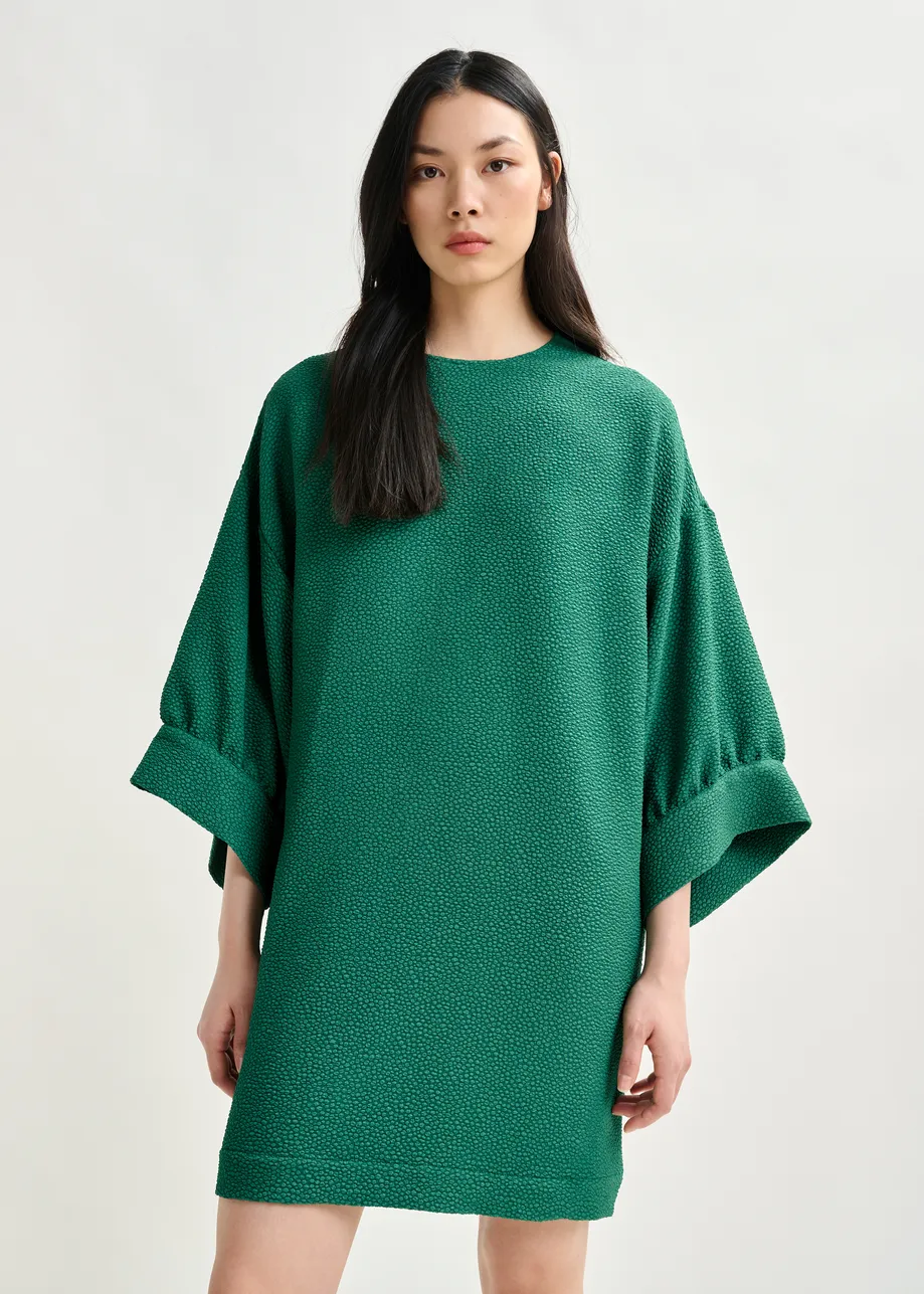 Green mini dress with wide sleeves