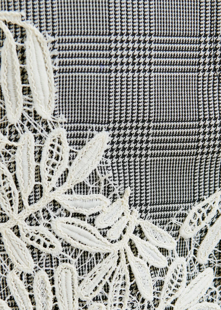 Grey, black and white checked asymmetric skirt with lace appliqué