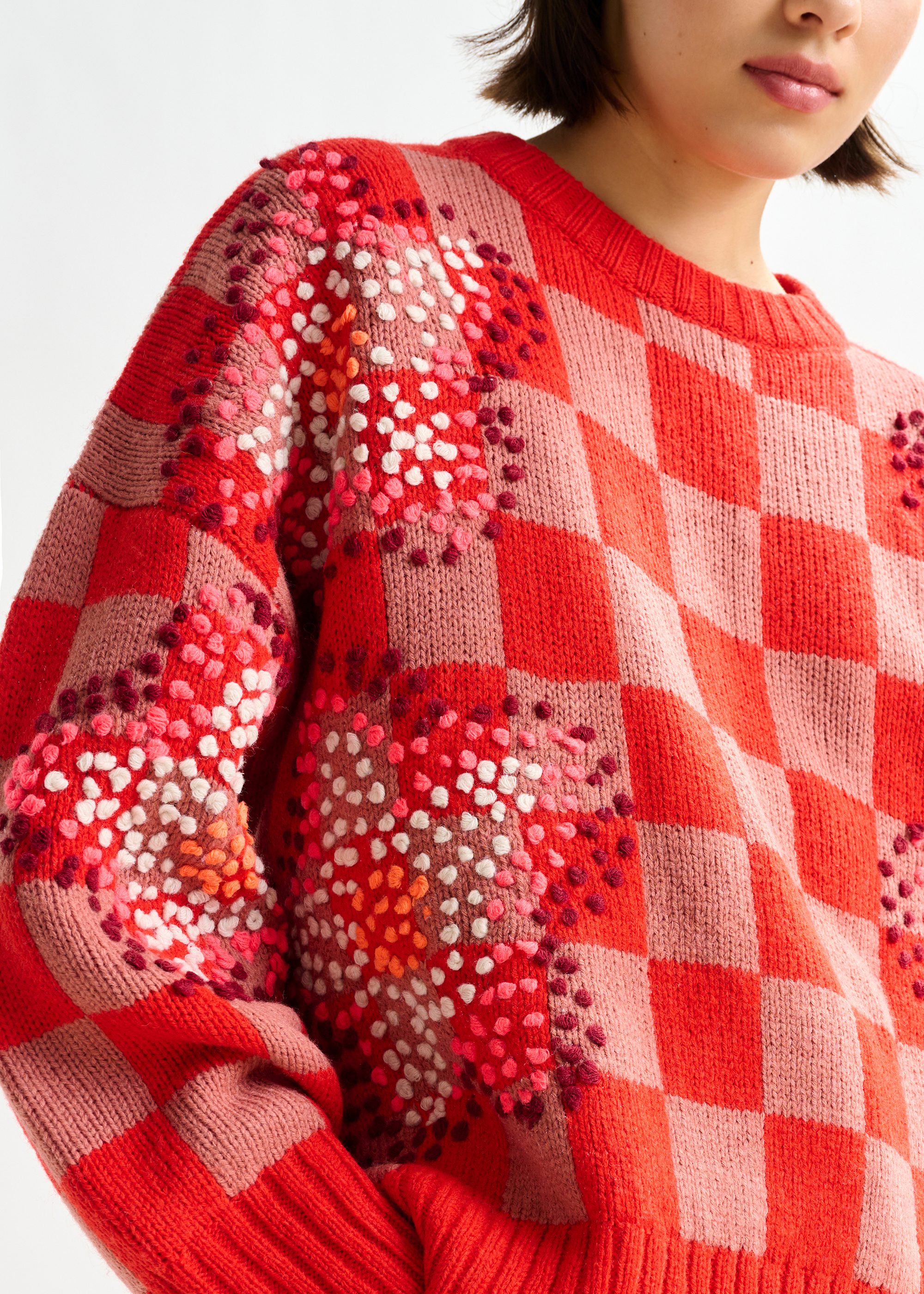 Red, brown and off-white checkerboard floral jacquard knit sweater