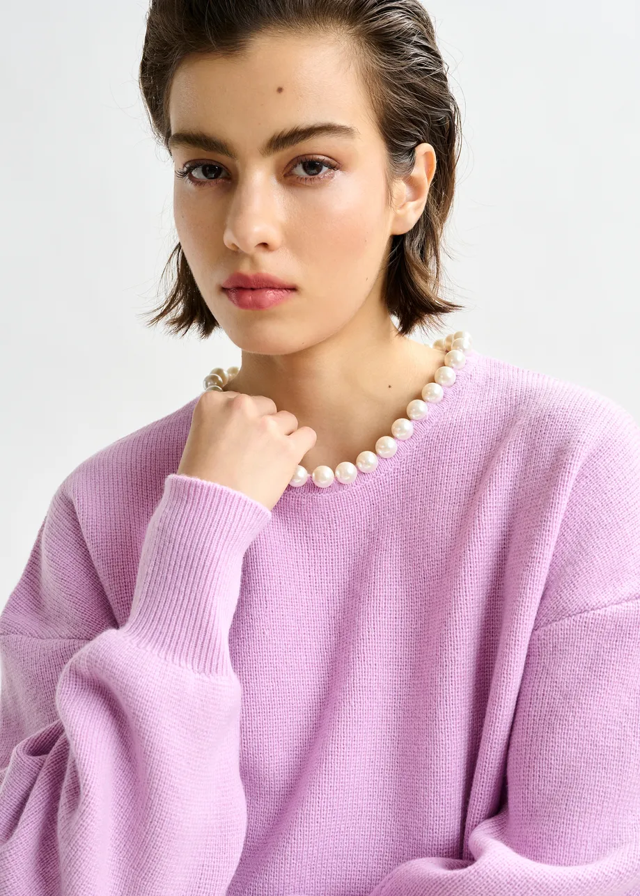 Light pink pearl-embellished knit sweater