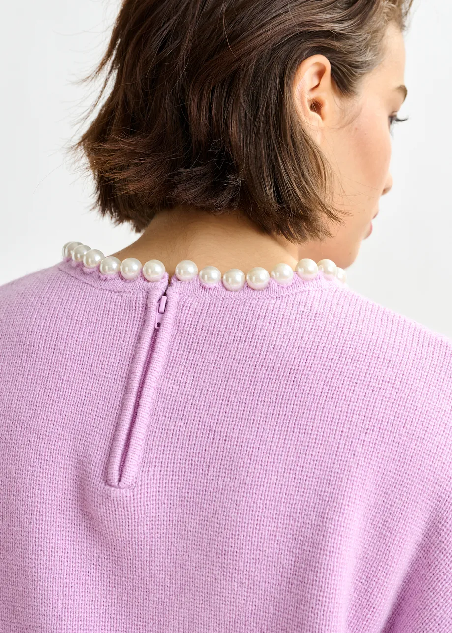 Light pink pearl-embellished knit sweater