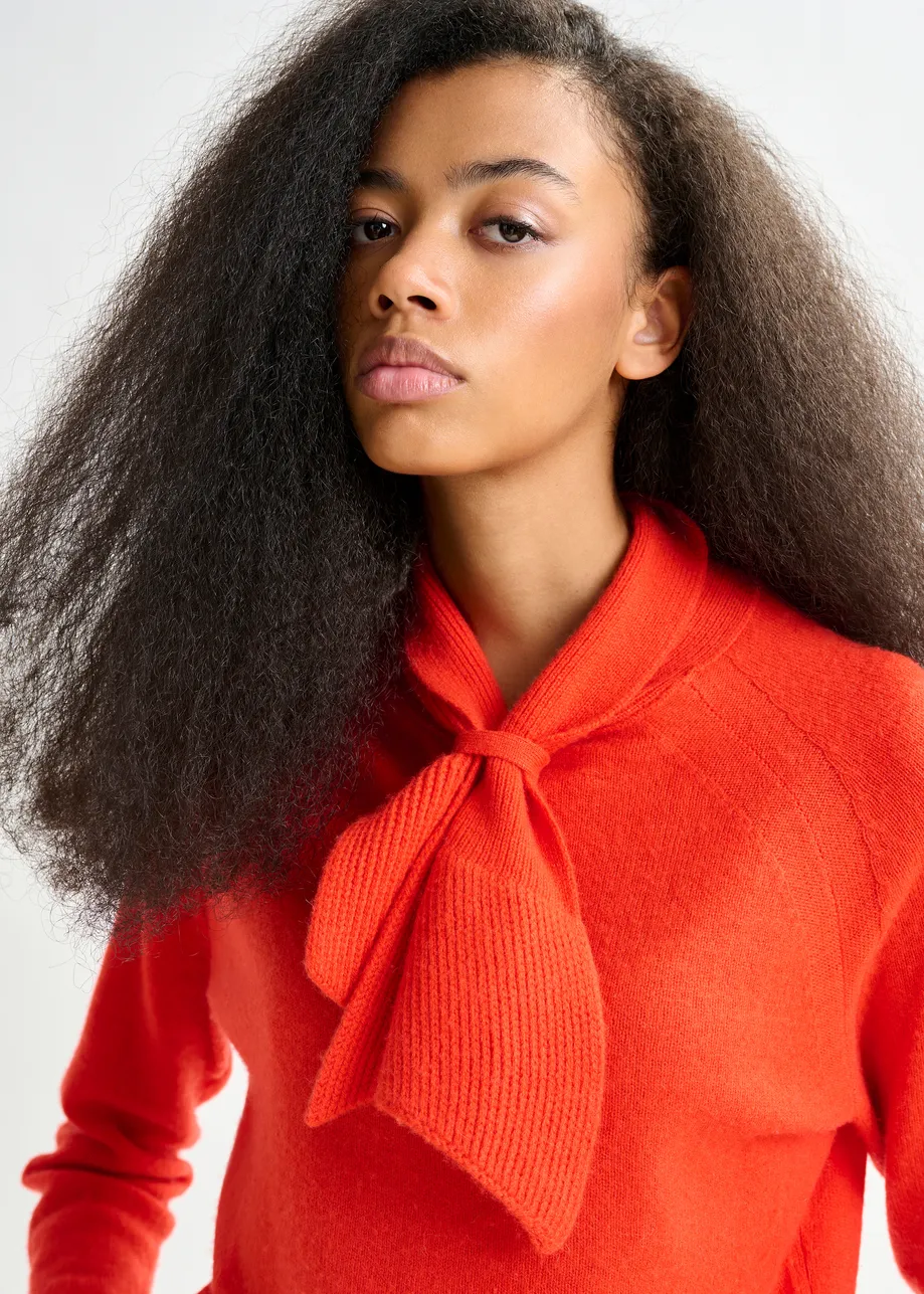 Orange cashmere sweater with pussy-bow tie
