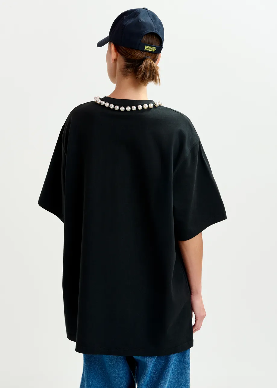 Black and white oversized cotton T-shirt with "HUH?"- print and bead embellishments