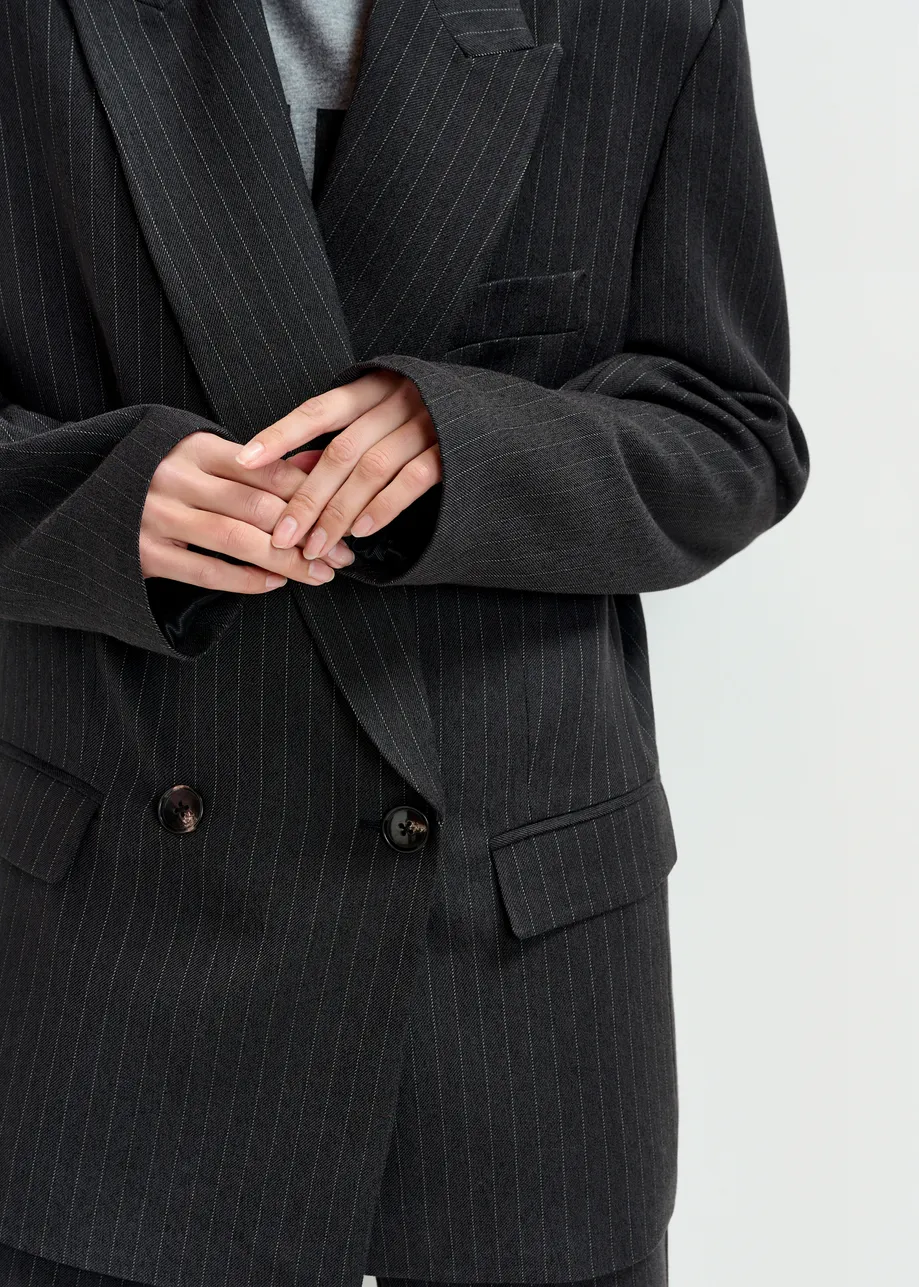 Navy and white double-breasted blazer with underarm zip detail