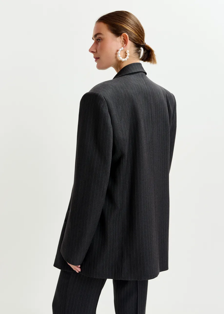 Navy and white double-breasted blazer with underarm zip detail